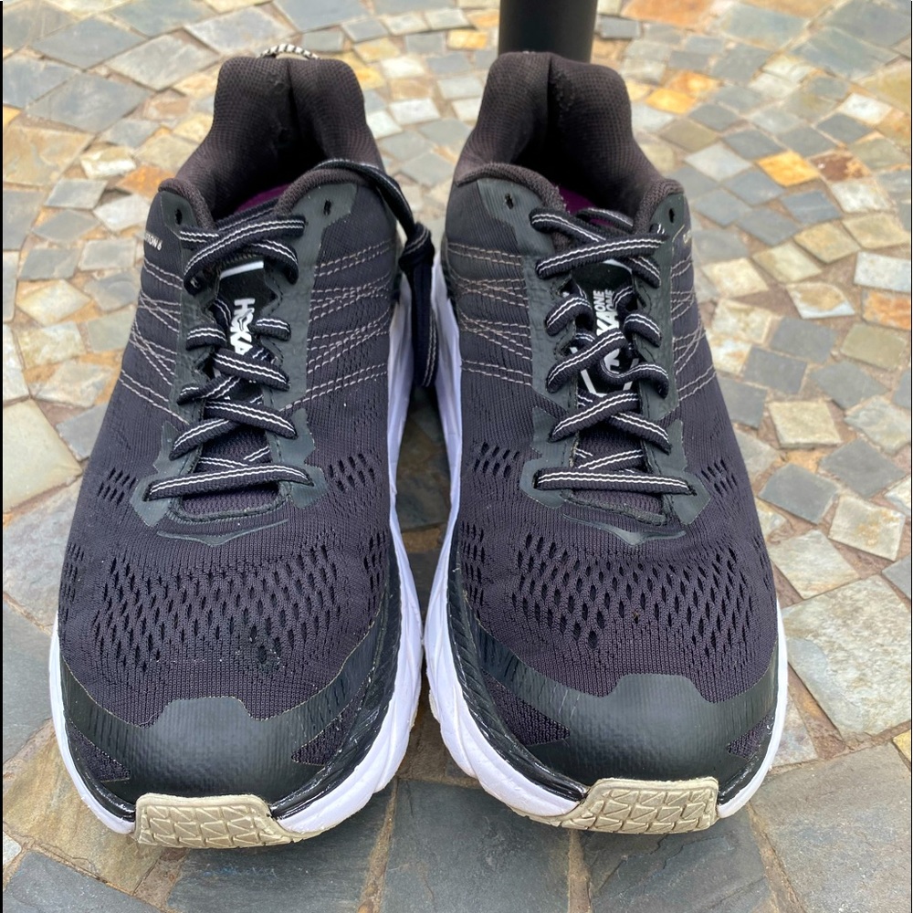 Black Hoka One One sneakers.